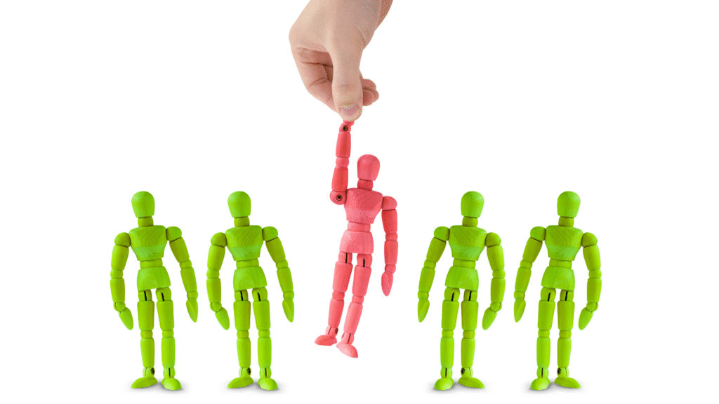 Hand selecting a red mannequin from a group of green figures to represent participant exclusion criteria.