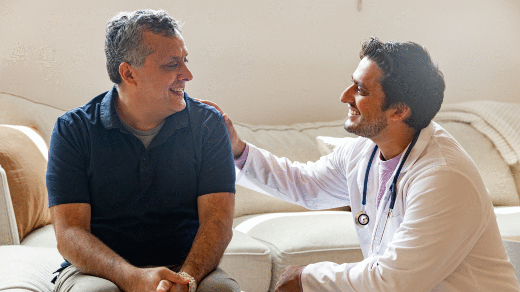 Doctor talking with an older male patient during a medical consultation